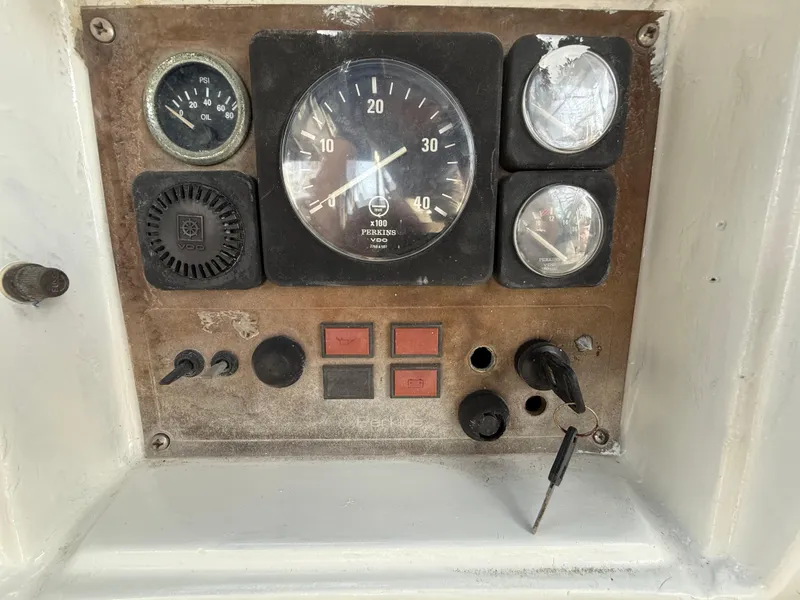 Slide: The Image of Control panel of a 1986 Beneteau Idylle 15.50 sailboat with gauges and switches. - 26