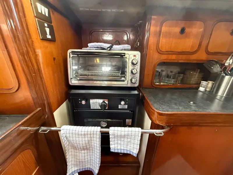 Slide: The Image of Galley kitchen in 1986 Beneteau Idylle 15.50 sailboat with oven and toaster. - 33