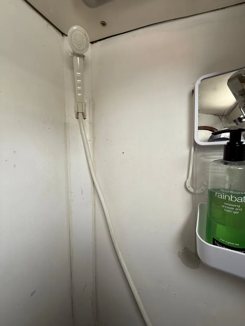 Slide: The Image of Shower area in 1986 Beneteau Idylle 15.50 yacht with soap dispenser and mirror. - 37