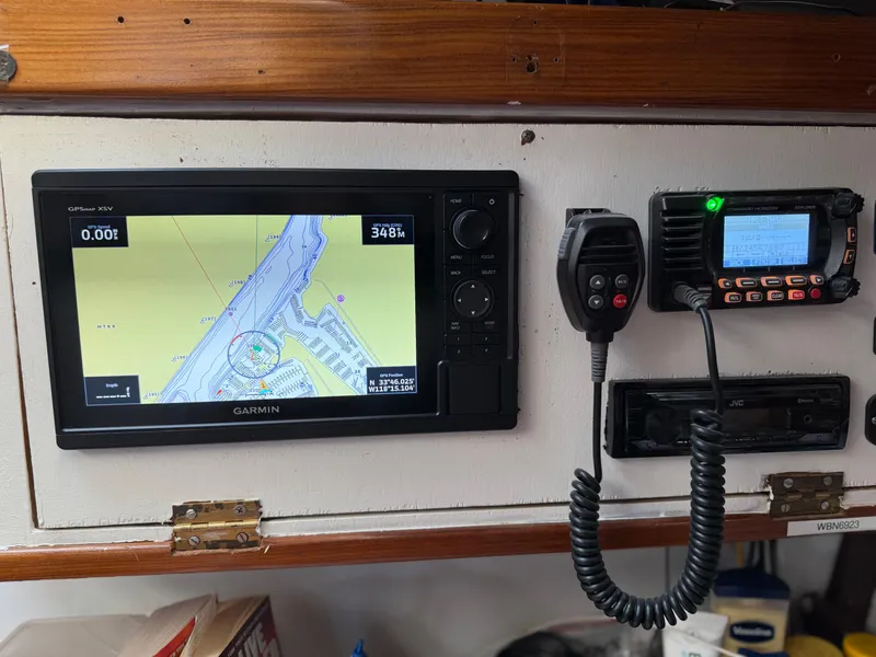 Slide: The Image of Navigation equipment on a 1986 Beneteau Idylle 15.50 sailboat, featuring Garmin GPS and radio. - 42