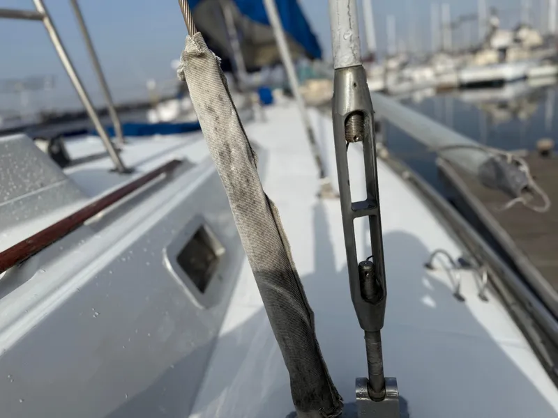 Slide: The Image of Close-up of 1986 Beneteau Idylle 15.50 sailboat deck with rigging details. - 9