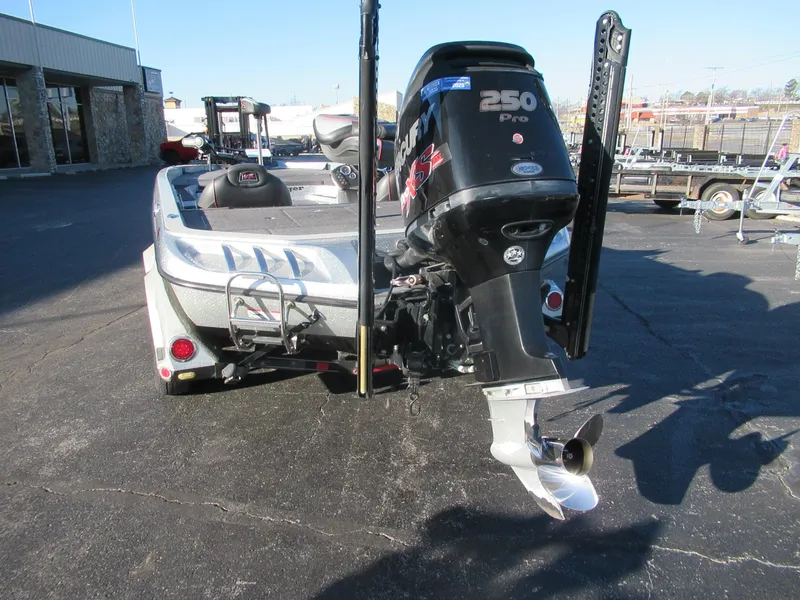 Slide: The Image of 2016 Ranger Z520 boat with 250 Pro motor, parked on asphalt. - 5