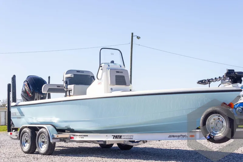 Slide: The Image of 2025 Pathfinder 2300 HPS boat on trailer, light blue hull, outdoor setting. - 13