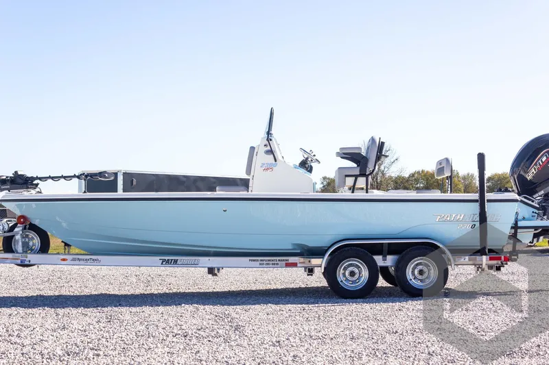 Slide: The Image of 2025 Pathfinder 2300 HPS boat on trailer, side view, outdoors. - 18