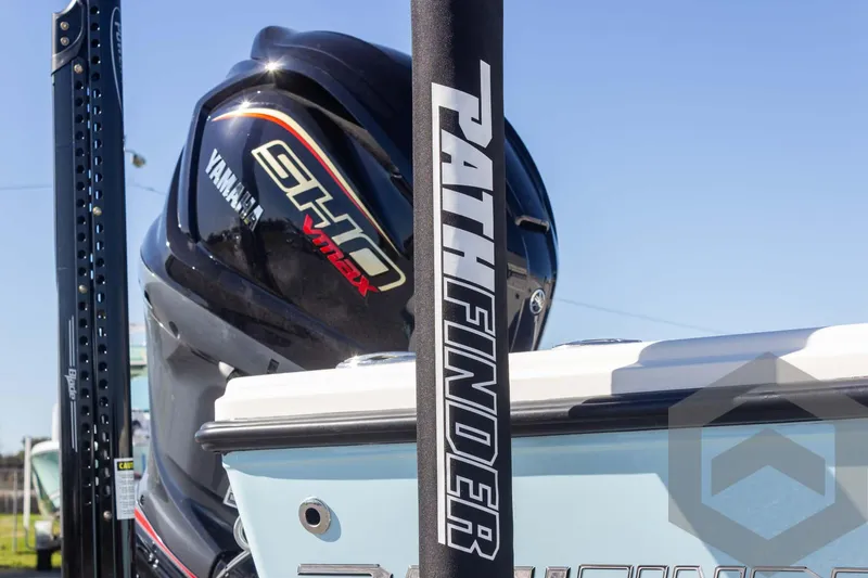 Slide: The Image of 2025 Pathfinder 2300 HPS boat with Yamaha engine, close-up view. - 24