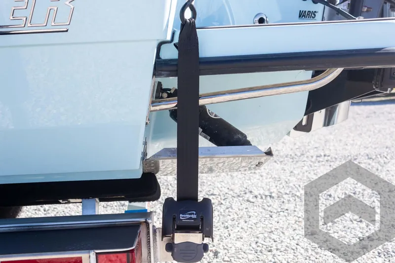 Slide: The Image of Pathfinder 2300 HPS 2025 boat with secure trailer strap and metal components. - 30
