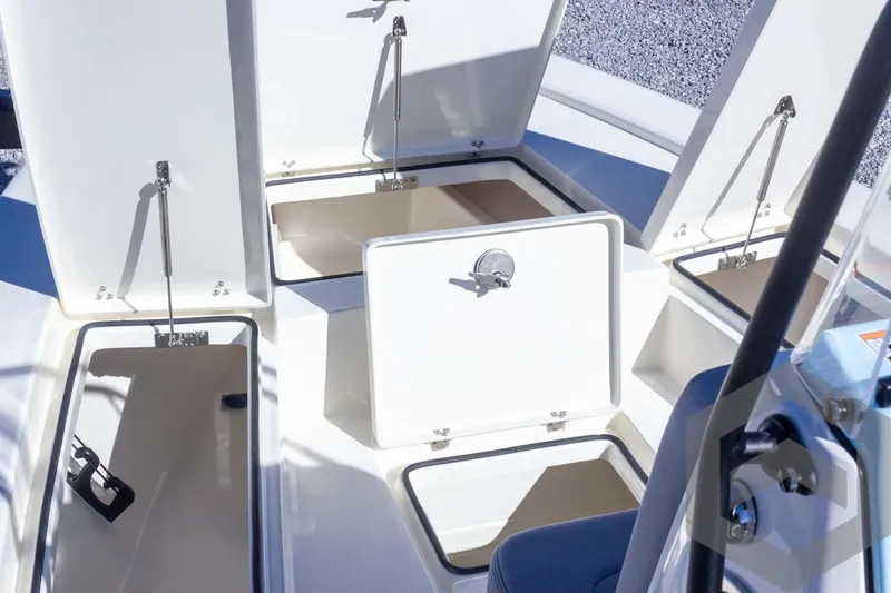 Slide: The Image of 2025 Pathfinder 2300 HPS boat storage compartments open, showcasing spacious interior design. - 33
