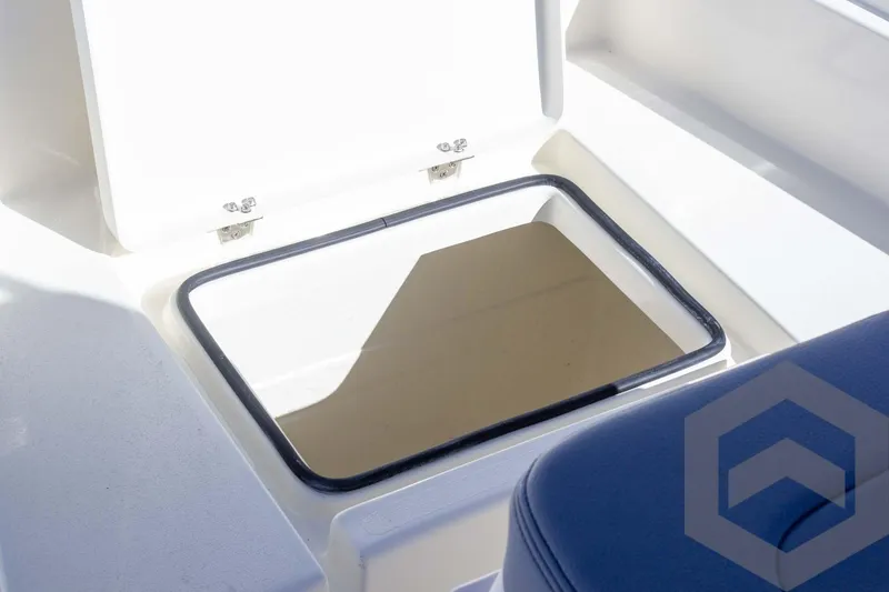 Slide: The Image of Open storage compartment on 2025 Pathfinder 2300 HPS boat. - 36