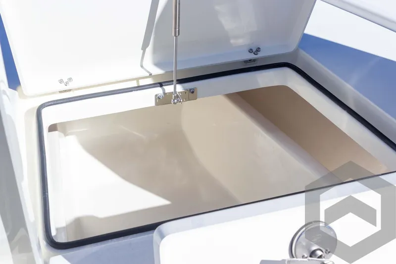 Slide: The Image of Pathfinder 2300 HPS 2025 boat storage compartment with open lid and hydraulic support. - 37