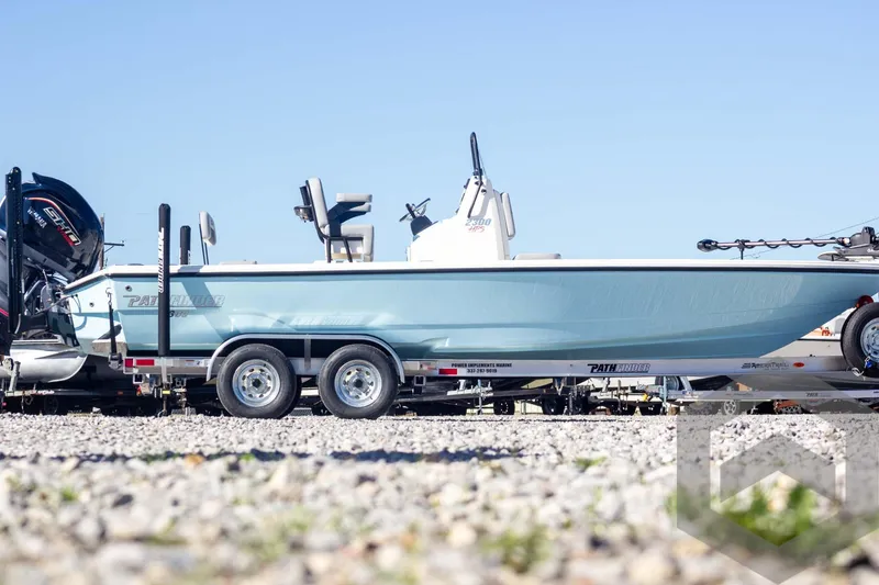Slide: The Image of 2025 Pathfinder 2300 HPS boat on trailer, side view, outdoors. - 4