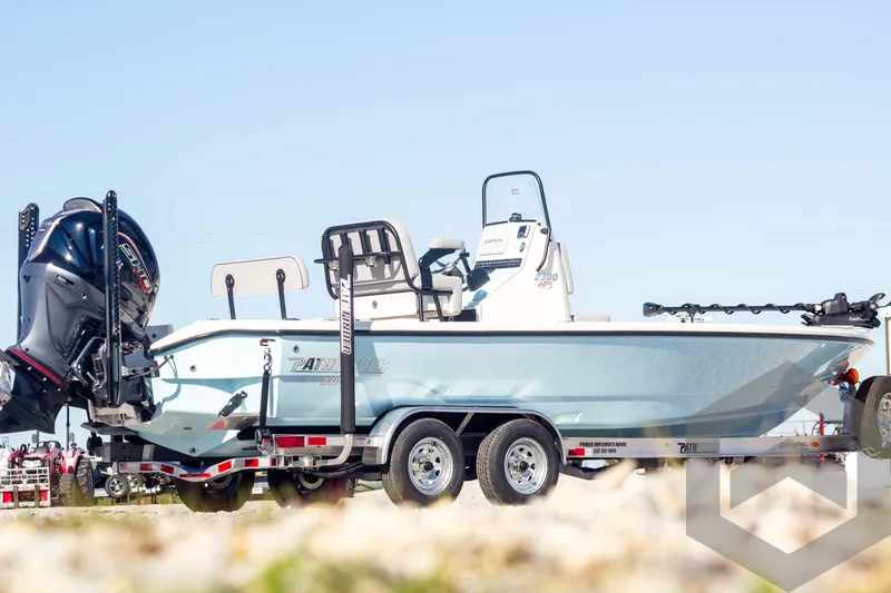 Slide: The Image of 2025 Pathfinder 2300 HPS boat on trailer, side view, outdoors. - 6