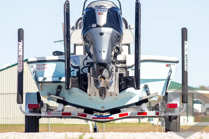 Slide: The Image of 2025 Pathfinder 2300 HPS boat on trailer, rear view with powerful outboard motor. - 7