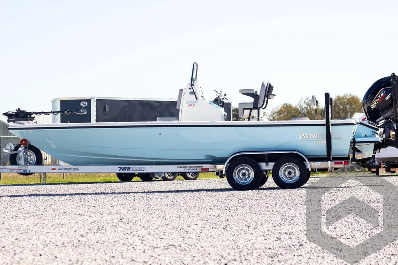 Slide: The Image of 2025 Pathfinder 2300 HPS boat on trailer, side view, outdoors. - 9