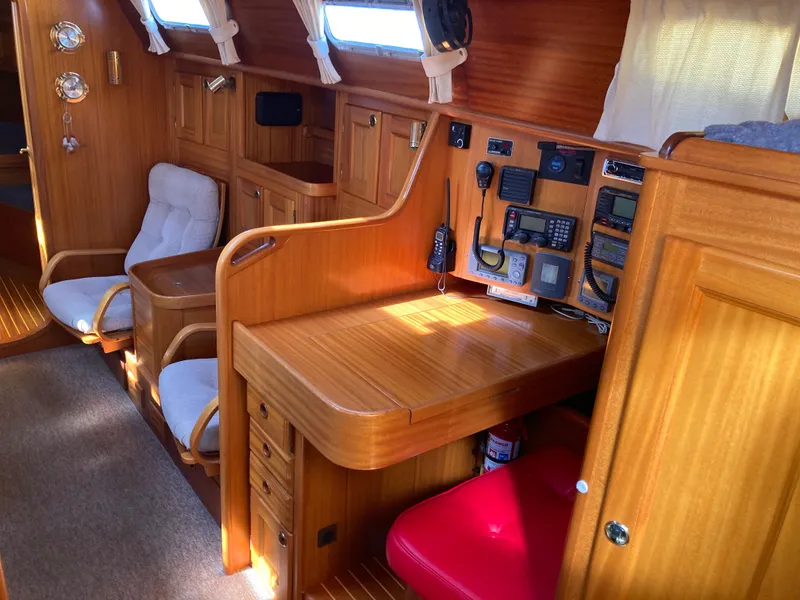 Slide: The Image of Interior of a 2001 Malo 43 yacht with wooden furnishings and navigation equipment. - 16