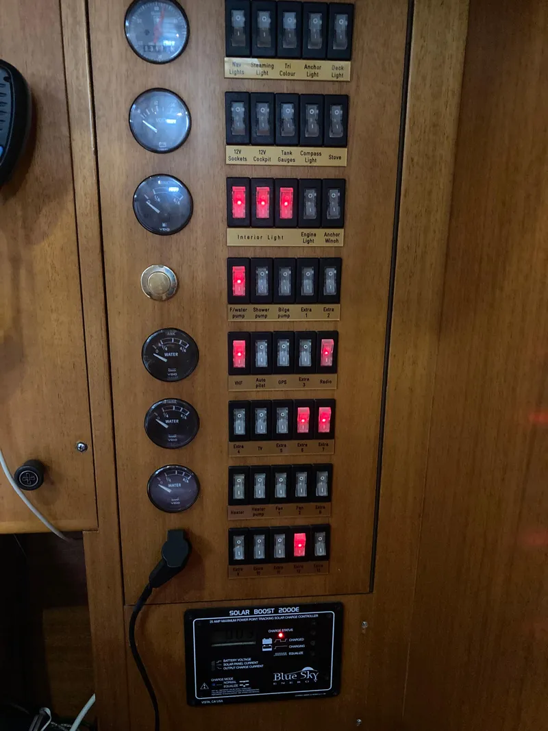 Slide: The Image of Electrical control panel on a 2001 Malo 43 boat with gauges and switches. - 20