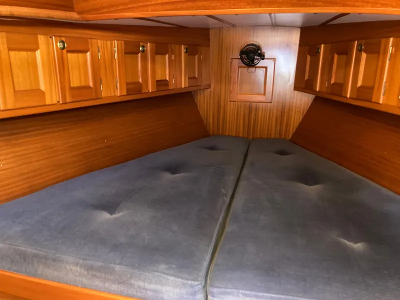 Slide: The Image of Cozy Malo 43 yacht cabin interior with wooden cabinets and blue cushions, 2001 model. - 26