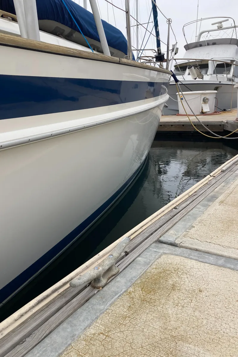 Slide: The Image of Sailboat Malo 43, 2001 model, docked at marina with other boats. - 39