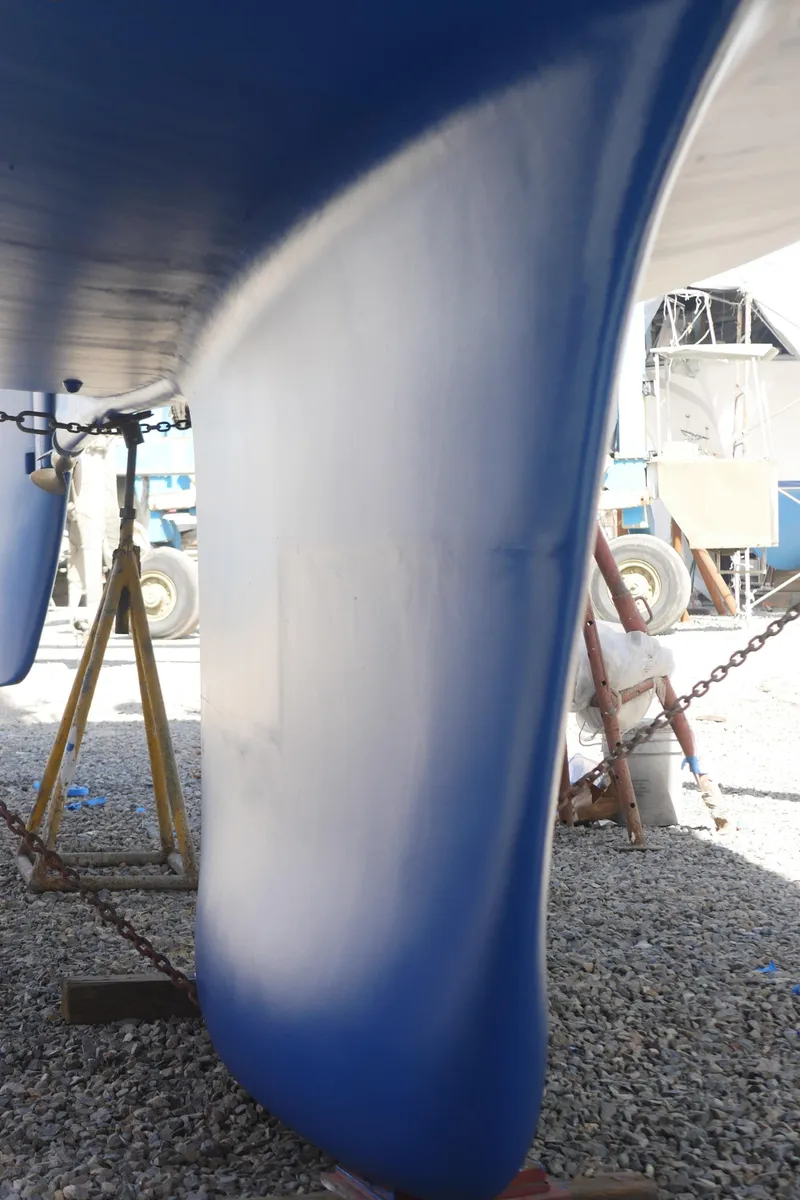 Slide: The Image of Close-up of a 2001 Malo 43 sailboat keel in a boatyard. - 41