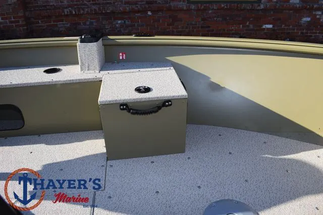 Slide: The Image of 2025 Lund 1875 Alaskan SS boat interior with storage compartments, Thayer's Marine logo visible. - 13