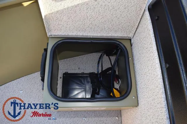 Slide: The Image of 2025 Lund 1875 Alaskan SS boat storage compartment with Thayer's Marine logo. - 16