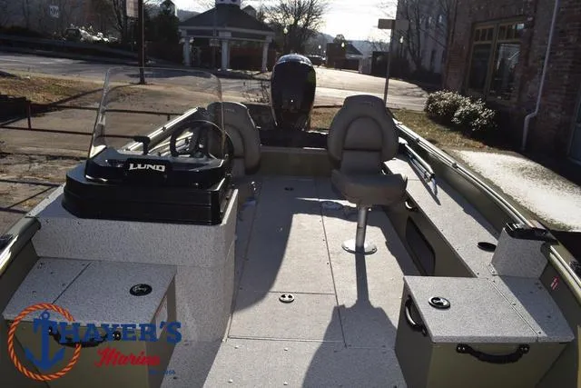 Slide: The Image of 2025 Lund 1875 Alaskan SS boat interior with seating and steering console. - 18