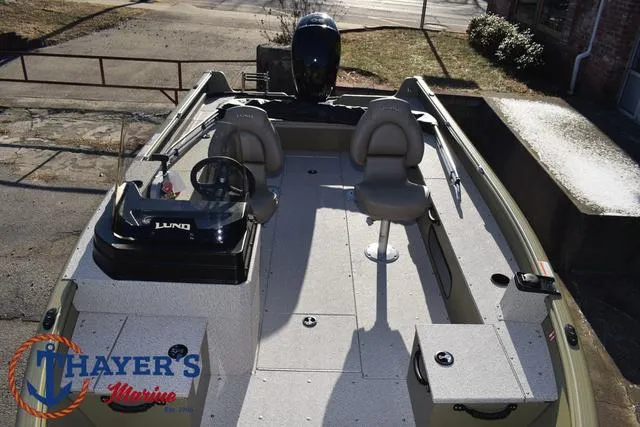 Slide: The Image of 2025 Lund 1875 Alaskan SS boat interior with seating and steering console. - 19