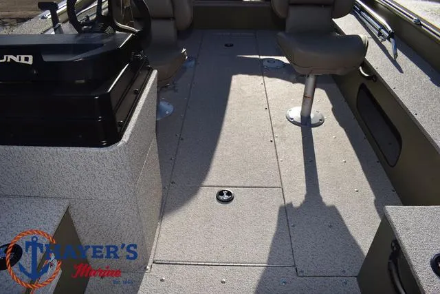 Slide: The Image of 2025 Lund 1875 Alaskan SS boat interior with seating and control console. - 23