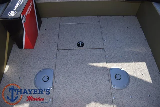 Slide: The Image of 2025 Lund 1875 Alaskan SS boat deck with storage compartments, Thayer's Marine branding. - 25