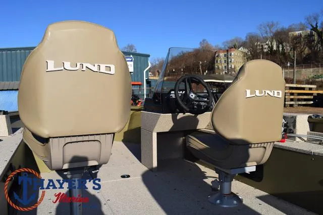 Slide: The Image of 2025 Lund 1875 Alaskan SS boat interior with branded seats and steering console. - 27