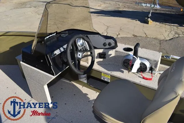 Slide: The Image of 2025 Lund 1875 Alaskan SS boat interior with steering wheel and controls. - 28