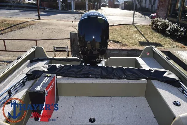 Slide: The Image of 2025 Lund 1875 Alaskan SS boat with motor, outdoor setting. - 32