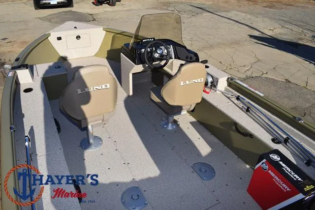 Slide: The Image of 2025 Lund 1875 Alaskan SS boat interior with seating and steering console. - 36