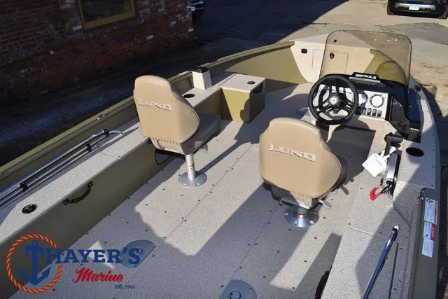 Slide: The Image of 2025 Lund 1875 Alaskan SS boat interior with steering wheel and seating. - 38
