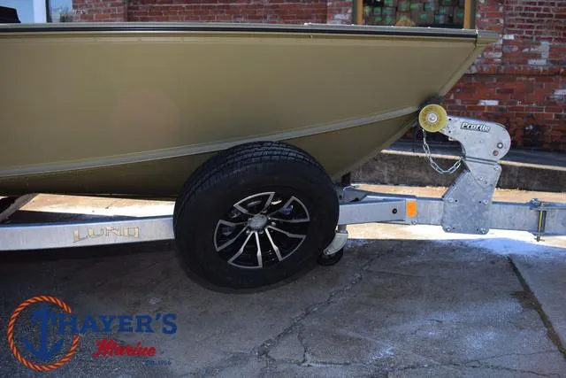 Slide: The Image of 2025 Lund 1875 Alaskan SS boat on trailer, featuring sleek design and durable construction. - 7