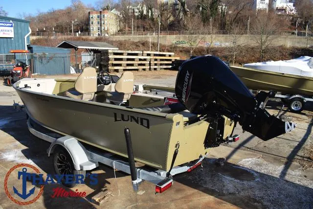 Slide: The Image of 2025 Lund 1875 Alaskan SS boat on trailer, outdoor setting, Thayer's Marine logo visible. - 9