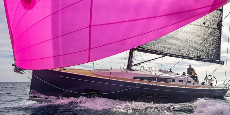 The Image of 2026 J Boats J/40 sailing with vibrant pink spinnaker on open water. - 0