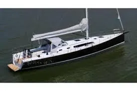 Slide: The Image of 2026 J Boats J/45 sailing yacht on calm water, side view. - 7