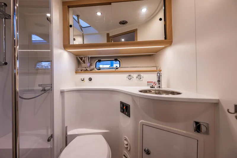 Slide: The Image of Luxurious bathroom in 2024 Nimbus 405 Flybridge yacht with modern fixtures and elegant design. - 17