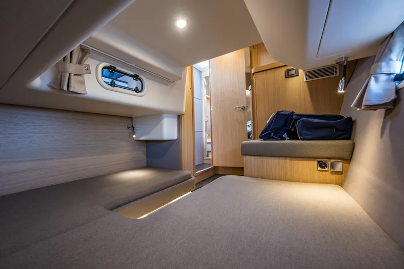 Slide: The Image of Luxurious interior cabin of 2024 Nimbus 405 Flybridge yacht, featuring modern design and cozy seating. - 20