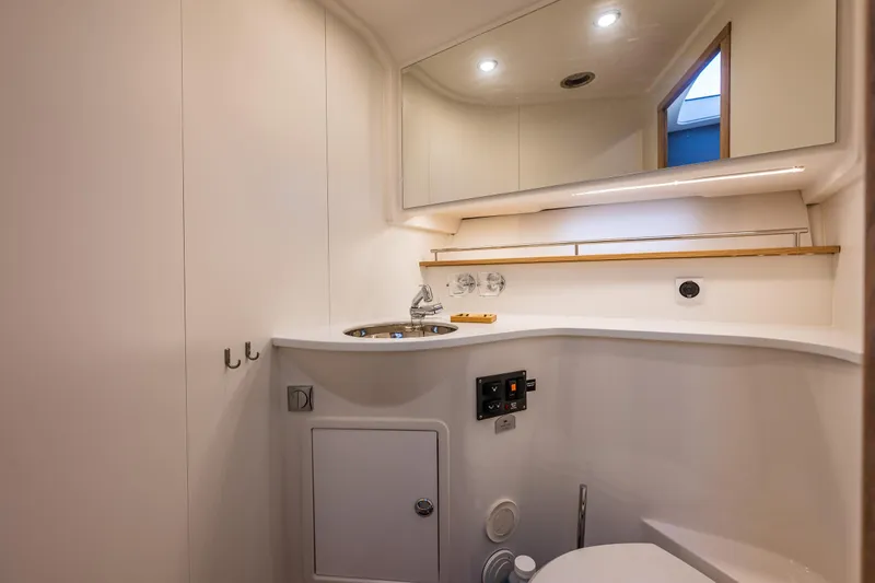 Slide: The Image of Luxurious bathroom in 2024 Nimbus 405 Flybridge yacht with modern fixtures and elegant design. - 21