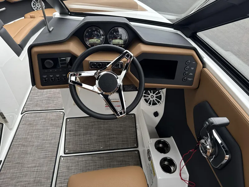 Slide: The Image of 2025 Cobalt CS23 boat dashboard with modern steering wheel and control panel. - 10