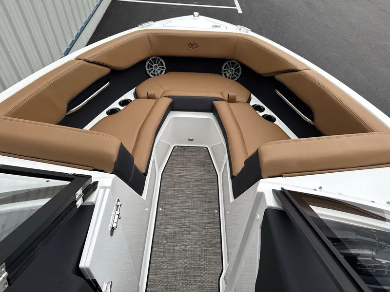 Slide: The Image of 2025 Cobalt CS23 boat interior with tan leather seating and modern design. - 7