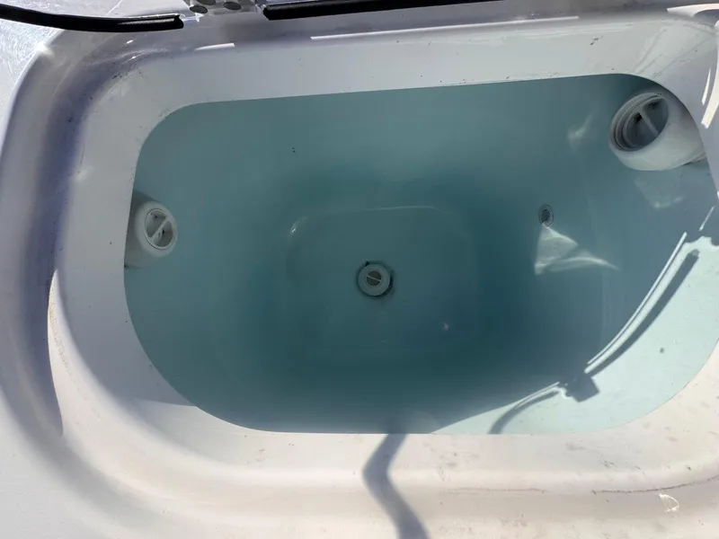 Slide: The Image of Livewell in 2024 Aquasport 2200 Center Console boat, filled with water. - 16