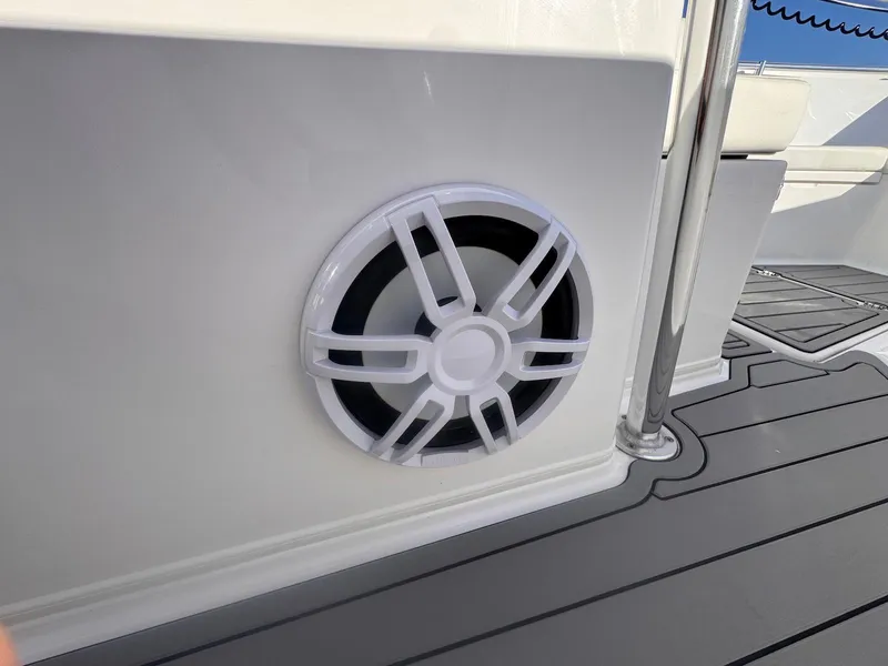 Slide: The Image of 2024 Aquasport 2200 Center Console boat speaker detail on deck. - 25