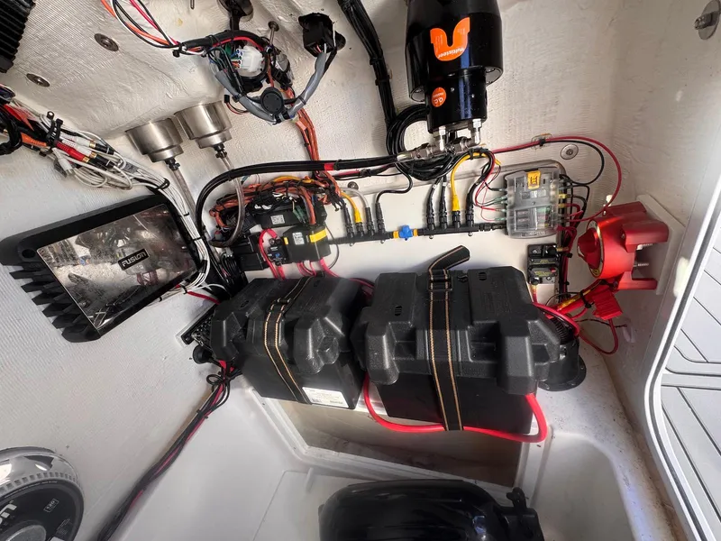 Slide: The Image of 2024 Aquasport 2200 Center Console electrical system with batteries and wiring. - 32