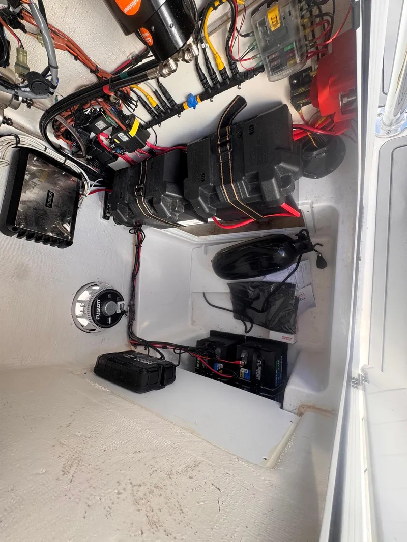 Slide: The Image of 2024 Aquasport 2200 Center Console interior wiring and battery setup. - 33