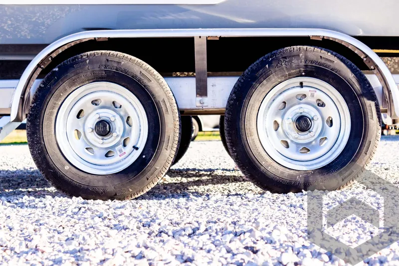 Slide: The Image of Trailer wheels on gravel, Pathfinder 2500 Hybrid, 2025 model. - 11