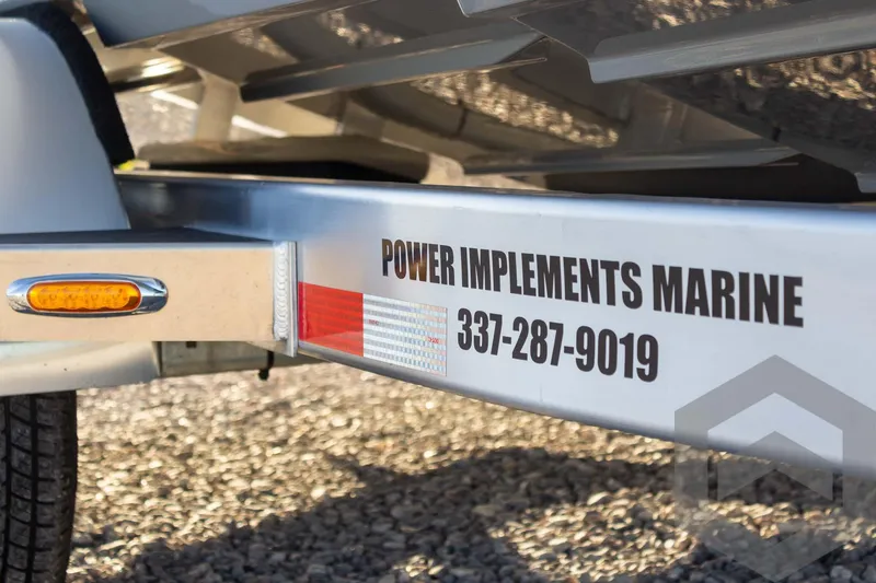 Slide: The Image of Trailer with "Power Implements Marine" contact, Pathfinder 2500 Hybrid 2025 model. - 16