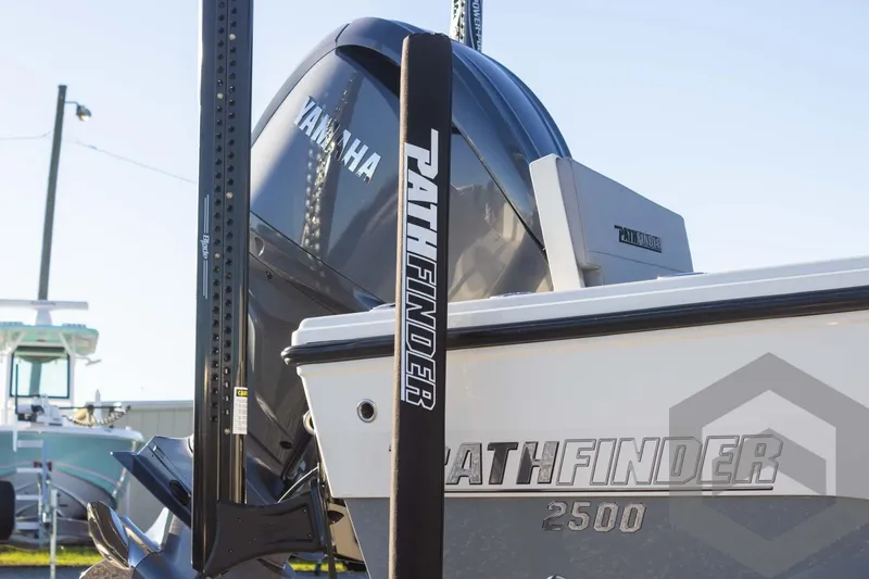 Slide: The Image of Pathfinder 2500 Hybrid 2025 boat with Yamaha engine, docked outdoors. - 17