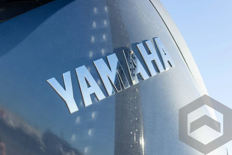 Slide: The Image of Yamaha logo on a 2025 Pathfinder 2500 Hybrid boat. - 23